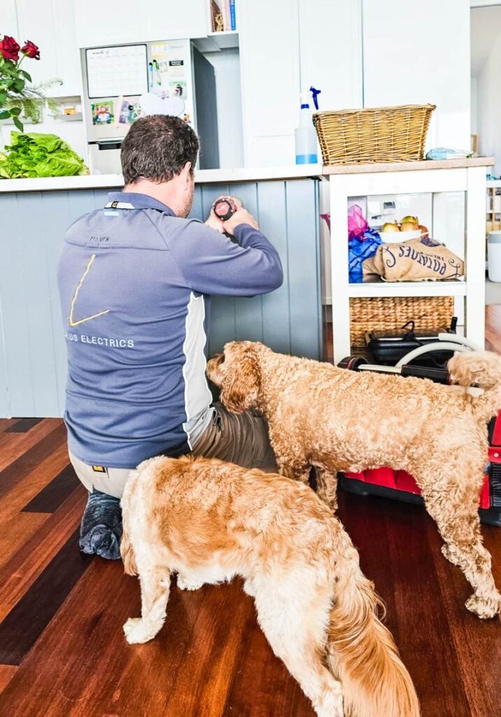 Electrician working in a residential kitchen